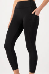 Black leggings worn by a person on a white background